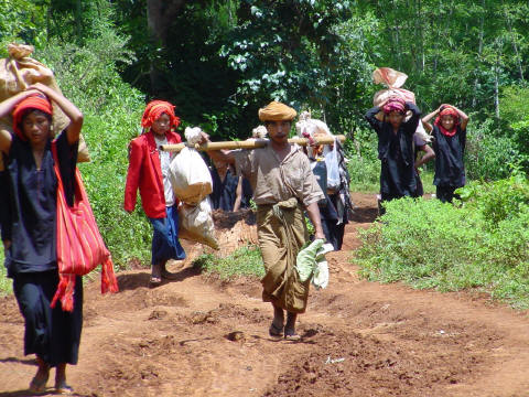 Shan tribal villagers approach on mountain trail.- Click For Full-Size Photo