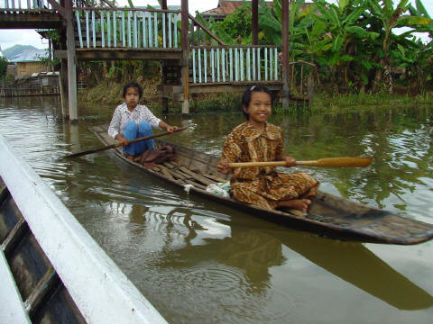 Intha children paddle on Inle lake- Click For Full-Size Photo