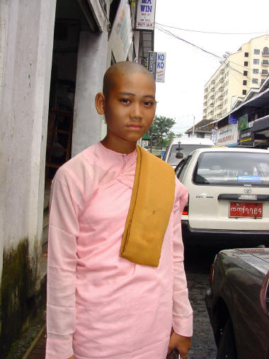 Woman monk in downtown Yangon- Click For Full-Size Photo