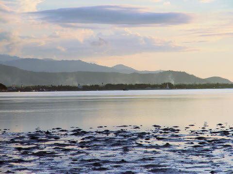 CLICK HERE - Dili viewed from across harbor during civil strife - smoke indicates battles and looting