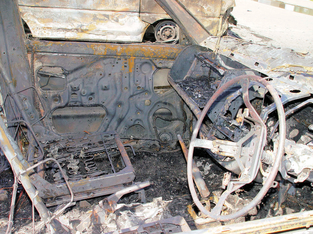 The Places of East Timor - Burned cars at Governer's Palace